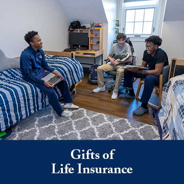 Students in a dorm room. Links to Gifts of Life Insurance