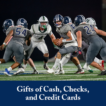 Students playing a football game. Links to Gifts of Cash, Check, and Credit Cards